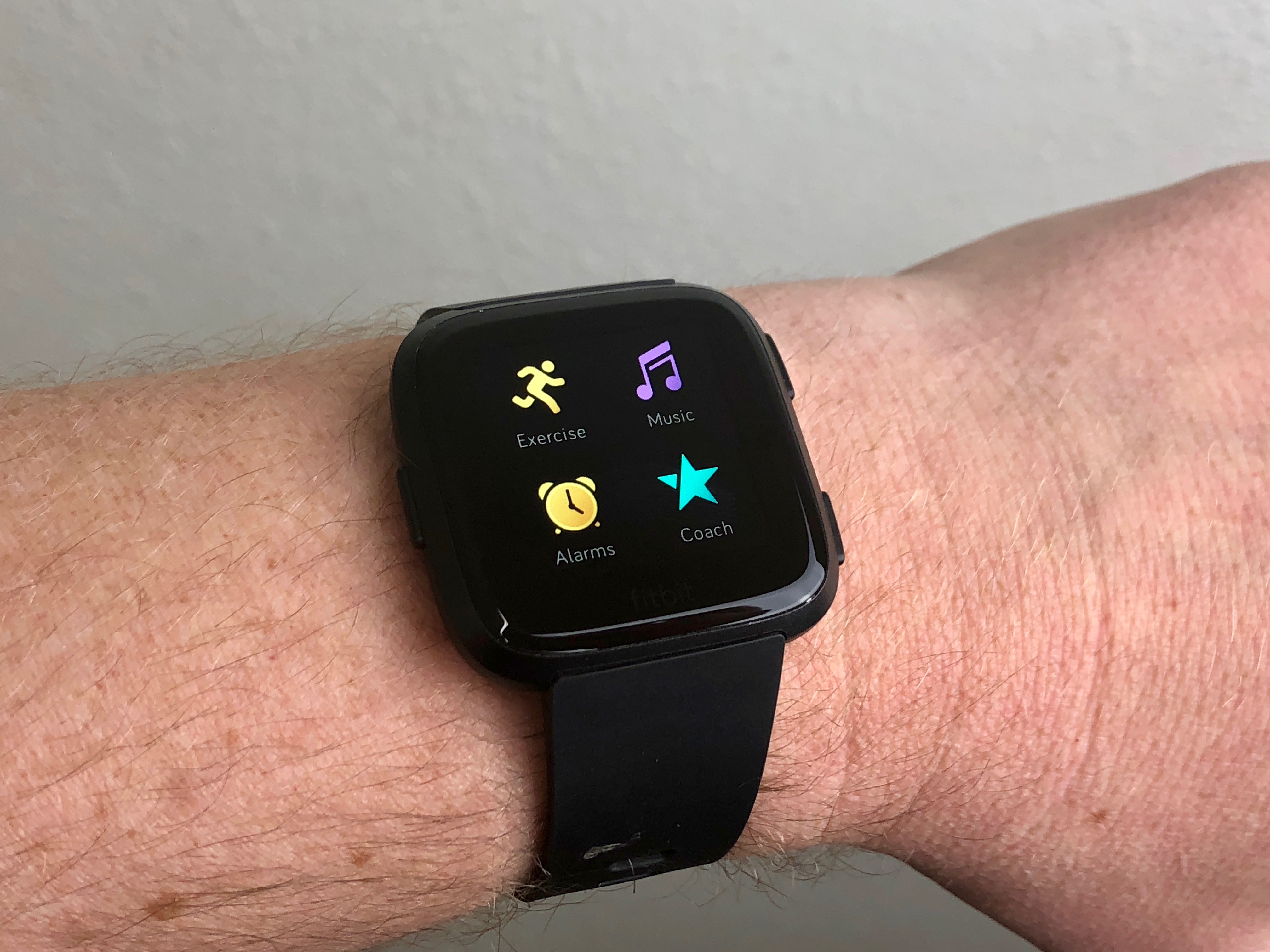 how do i listen to music on my fitbit versa