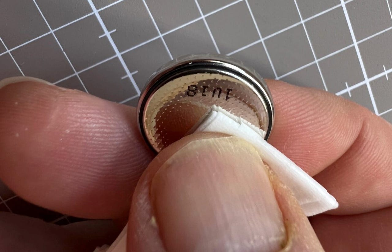 Removing a small amount of the bitter coating using an alcohol wipe