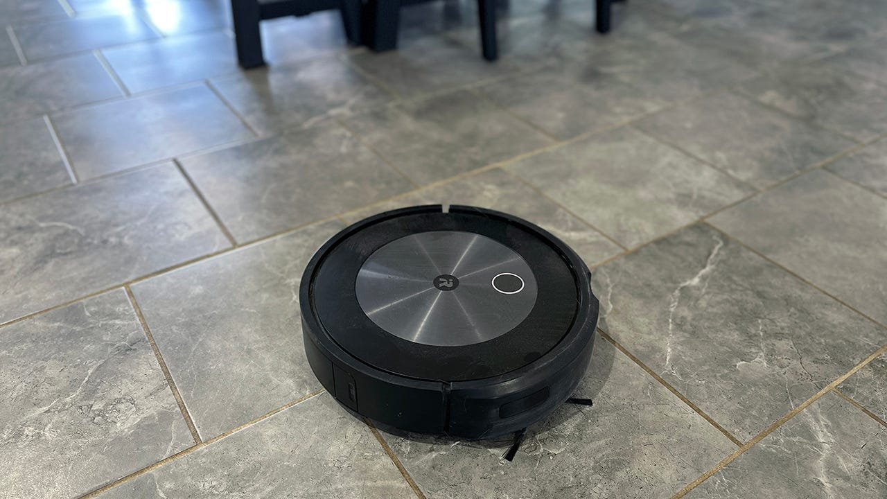 Roomba j7+ vacuums on tiles.