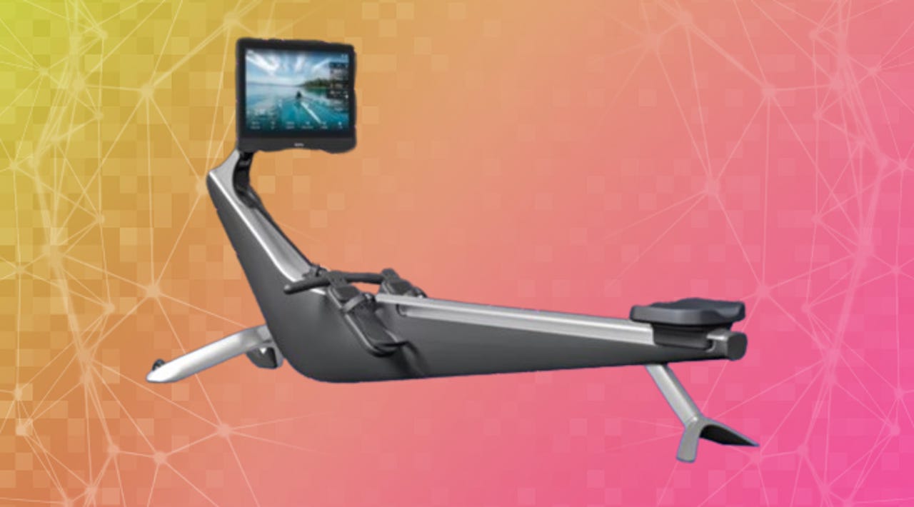 A Hydrow Pro Rower machine against a pink and orange background
