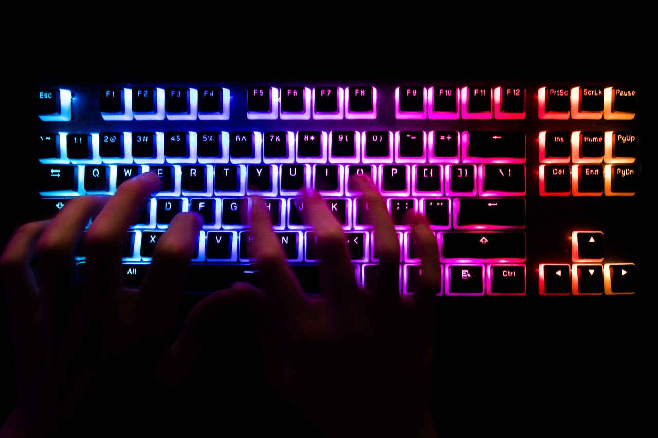 person playing colorful keyboard