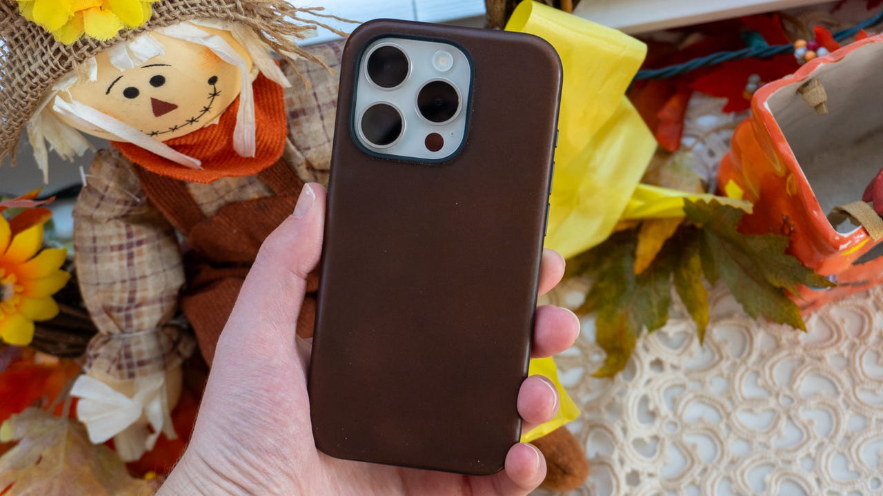 Nomad Modern Leather case on the iPhone 15 Pro held in-hand.