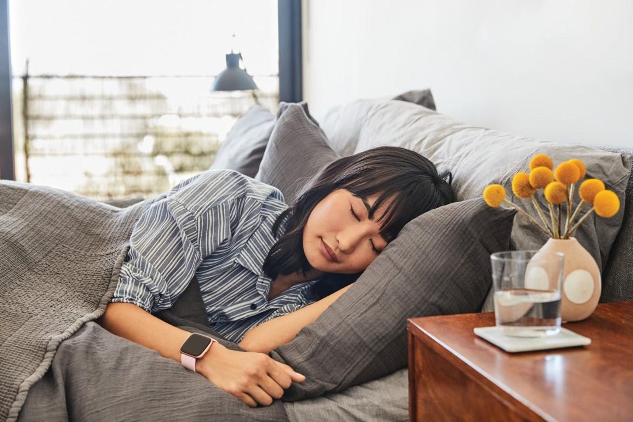 Person sleeping with a fitness band on.