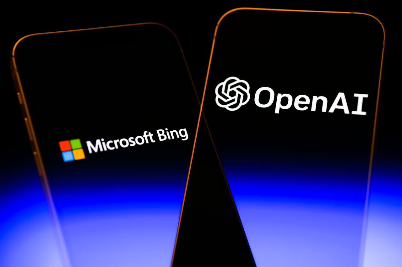 mobile phones. one reads "microsoft bing." the other reads "openAI"