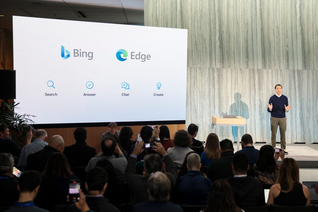 A man standing on stage of Bing and Edge event